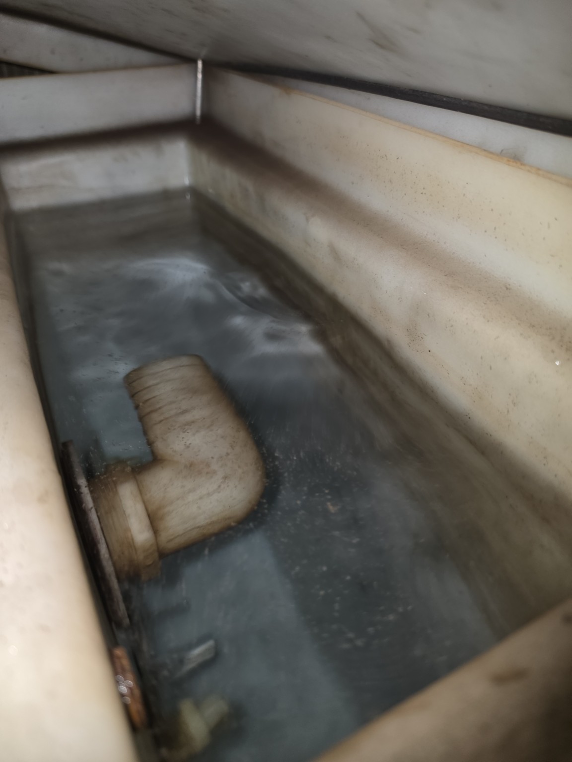 Contaminated laser chiller water and tank before service